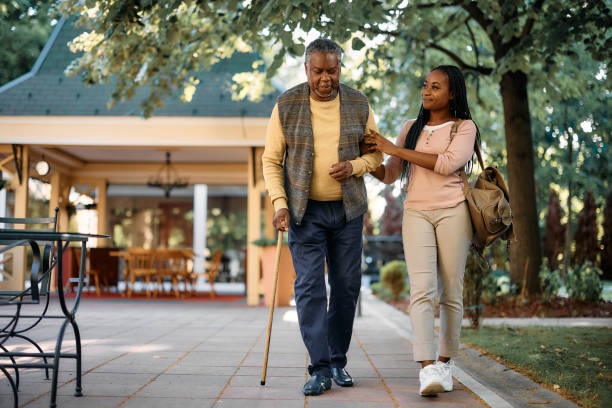 Caregiver walking outside with a client