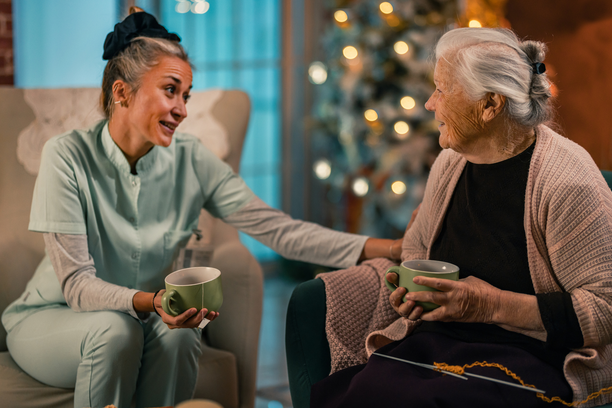 Caregiver sharing a quiet evening moment with a client